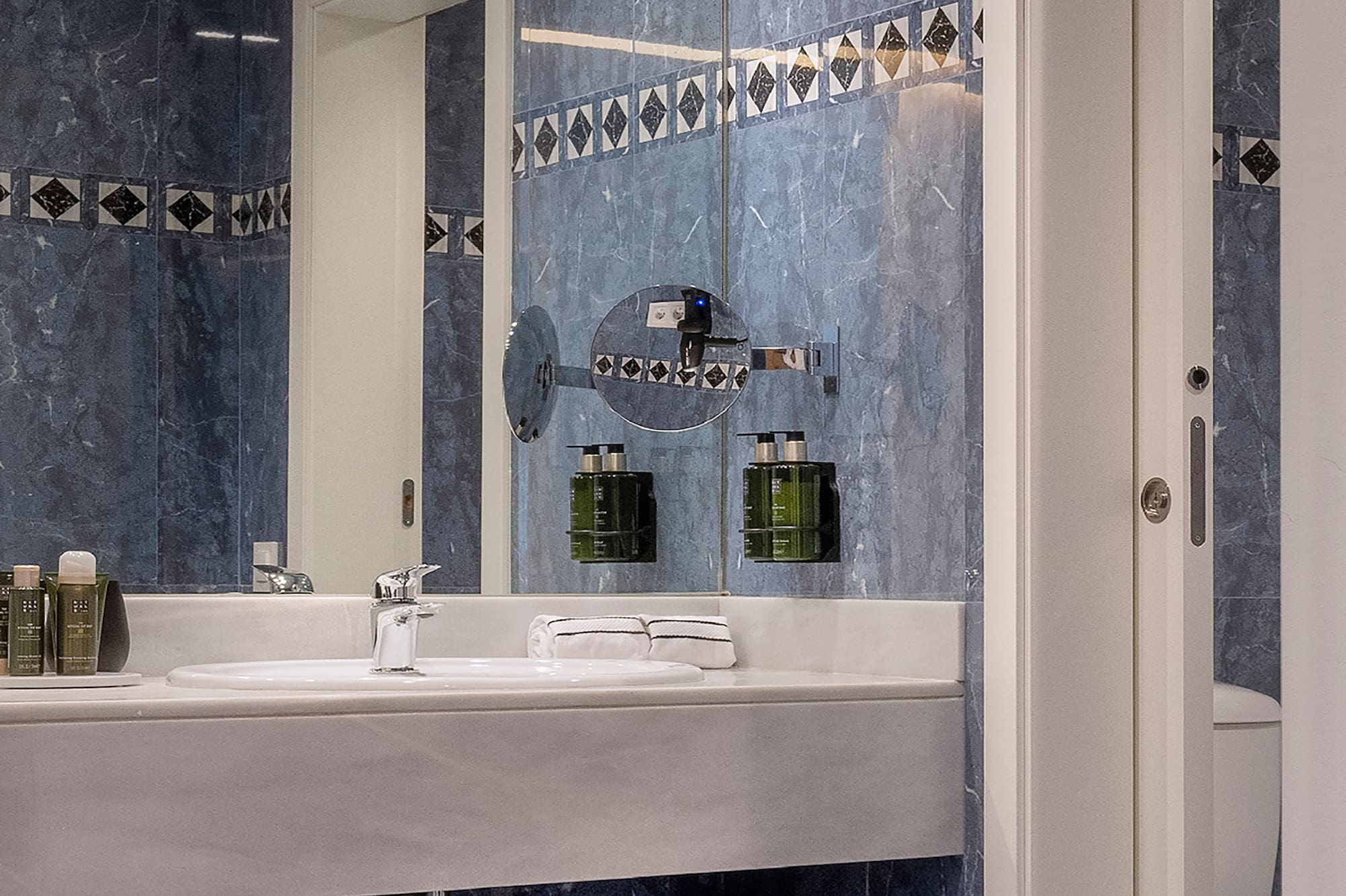 a bathroom with a mirror and sink