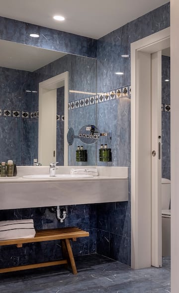 a bathroom with a mirror and sink