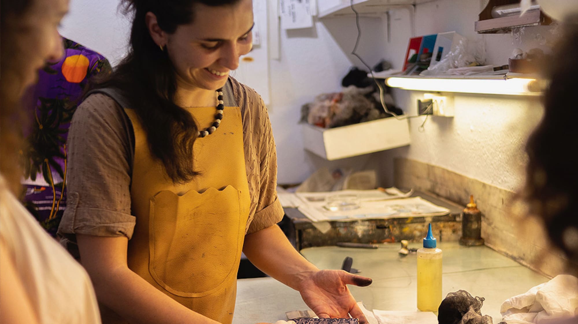 a woman smiling at a table