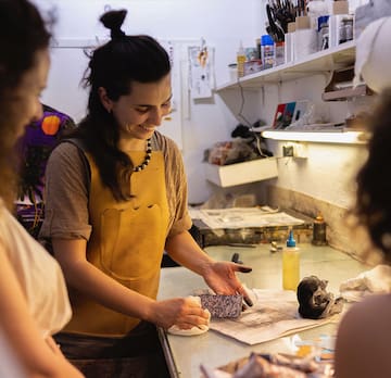 a woman smiling at a table