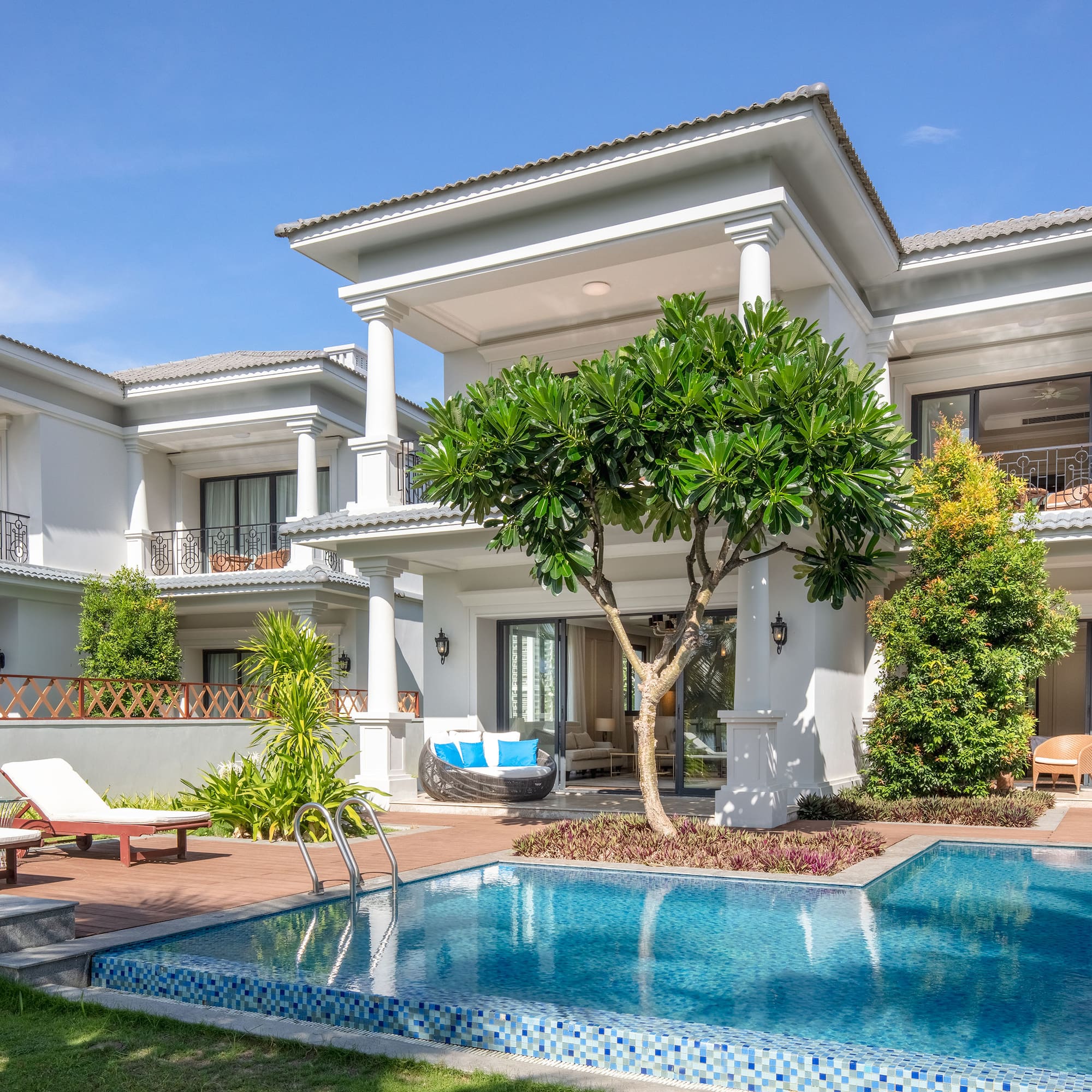 a pool in front of a house