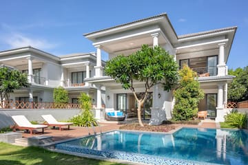 a pool in front of a house