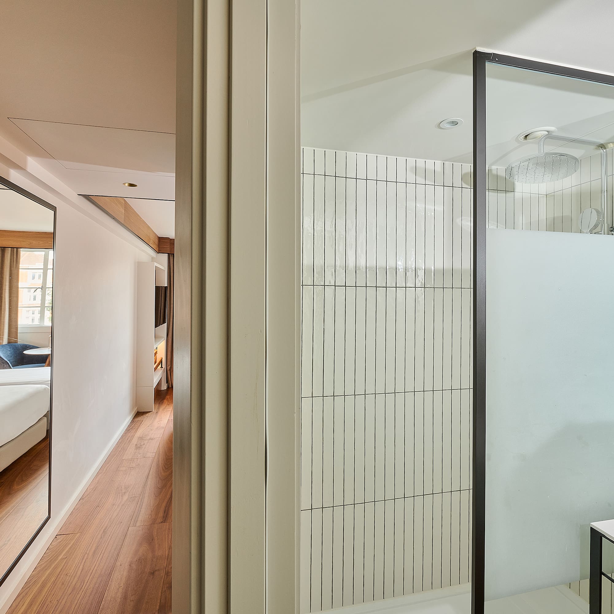 a room with a shower and a bed