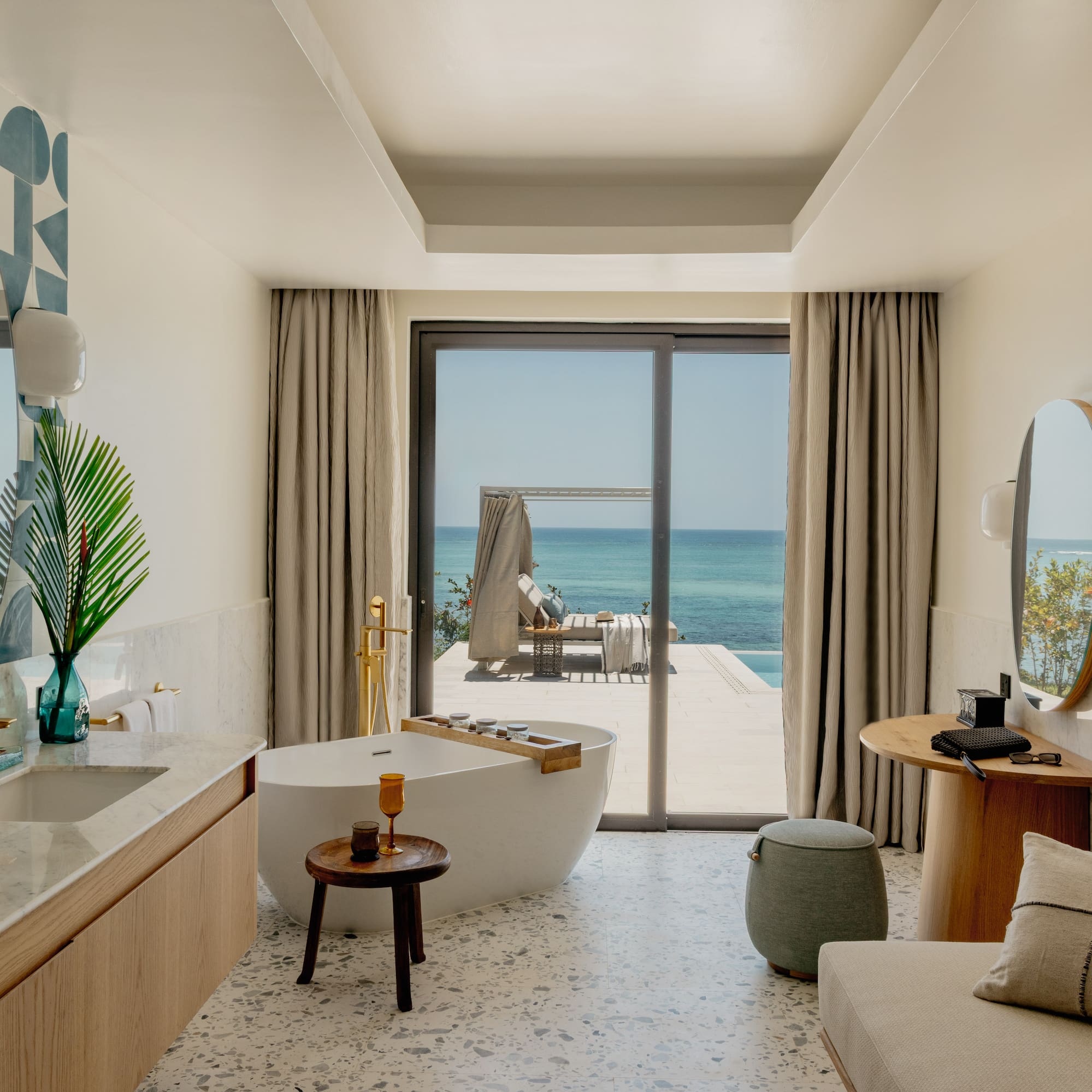 a bathroom with a tub and a mirror