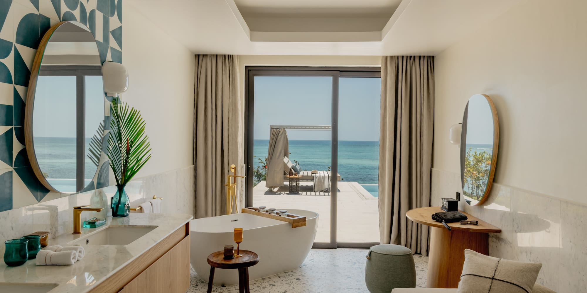 a bathroom with a tub and a mirror