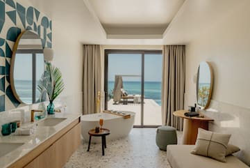 a bathroom with a tub and a mirror