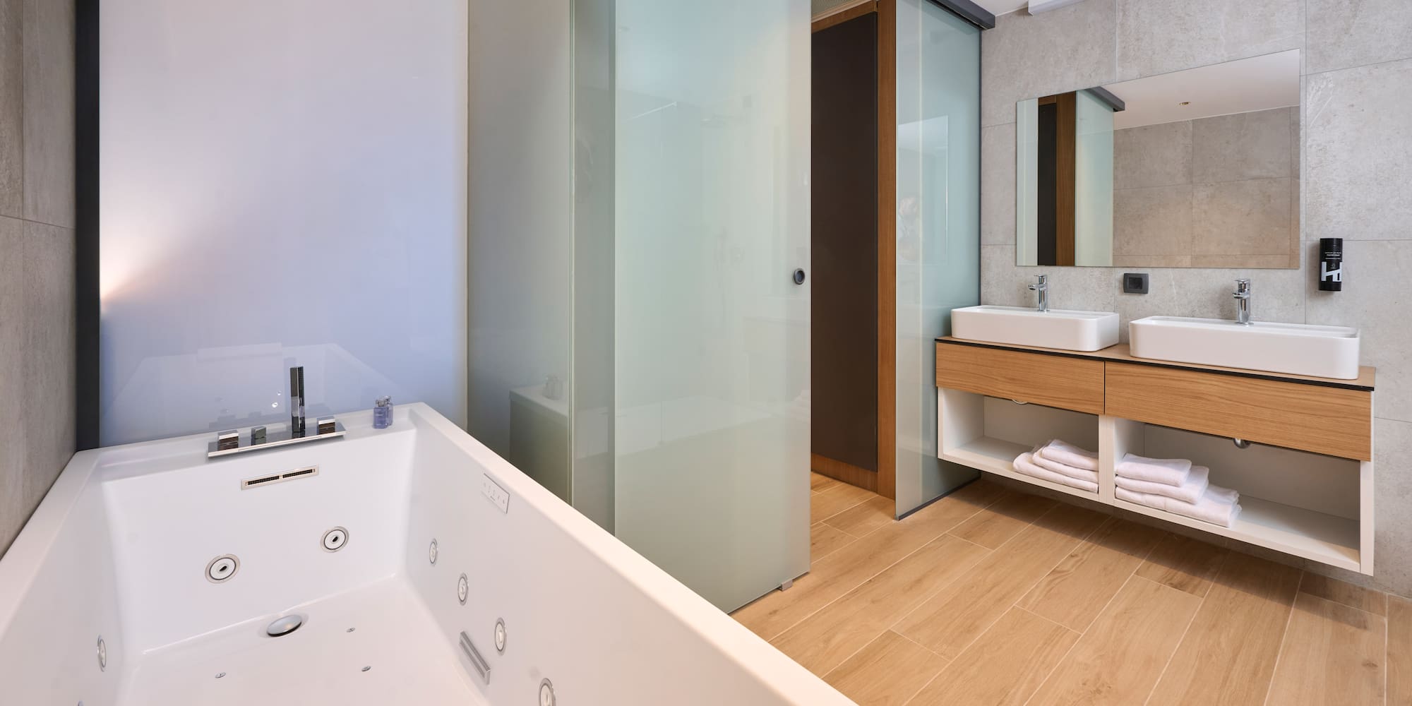 a bathroom with a bathtub and sink