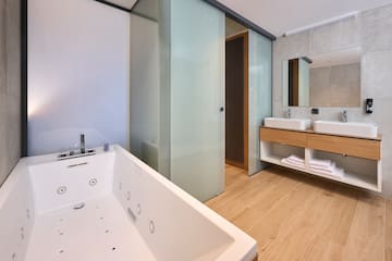 a bathroom with a bathtub and sink