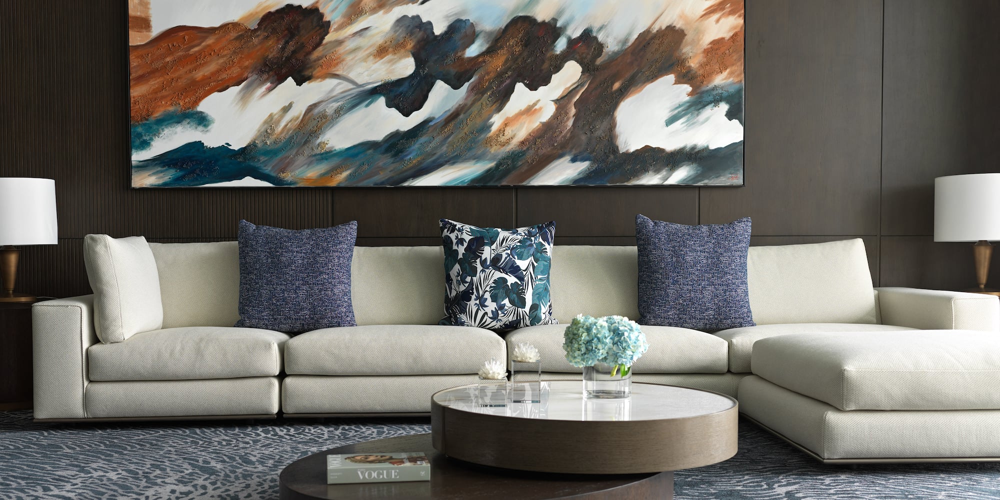 a large painting on a wall above a couch
