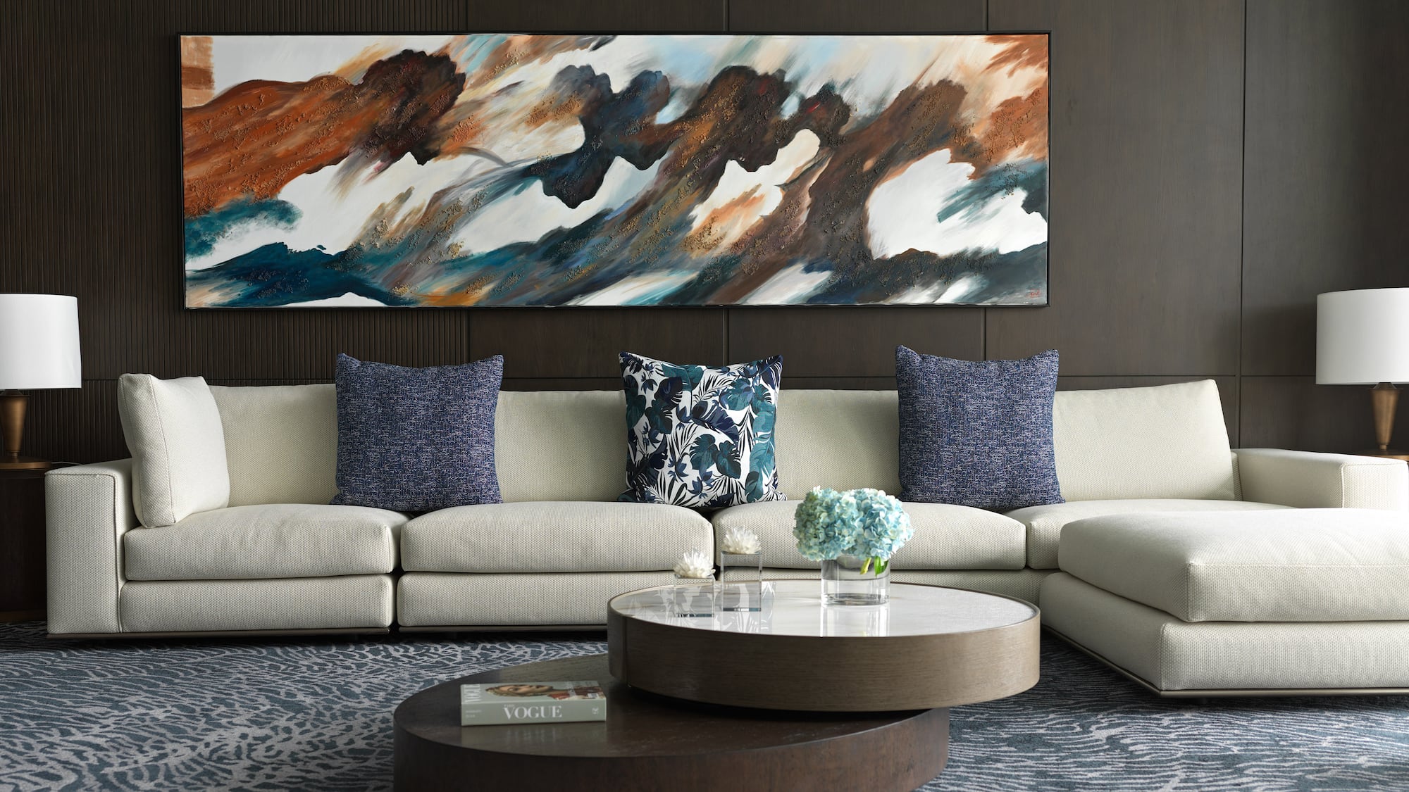 a large painting on a wall above a couch