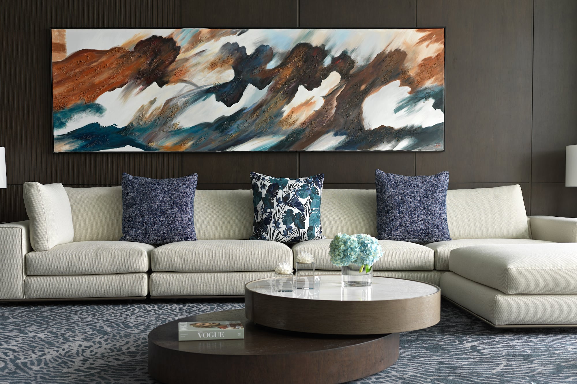 a large painting on a wall above a couch