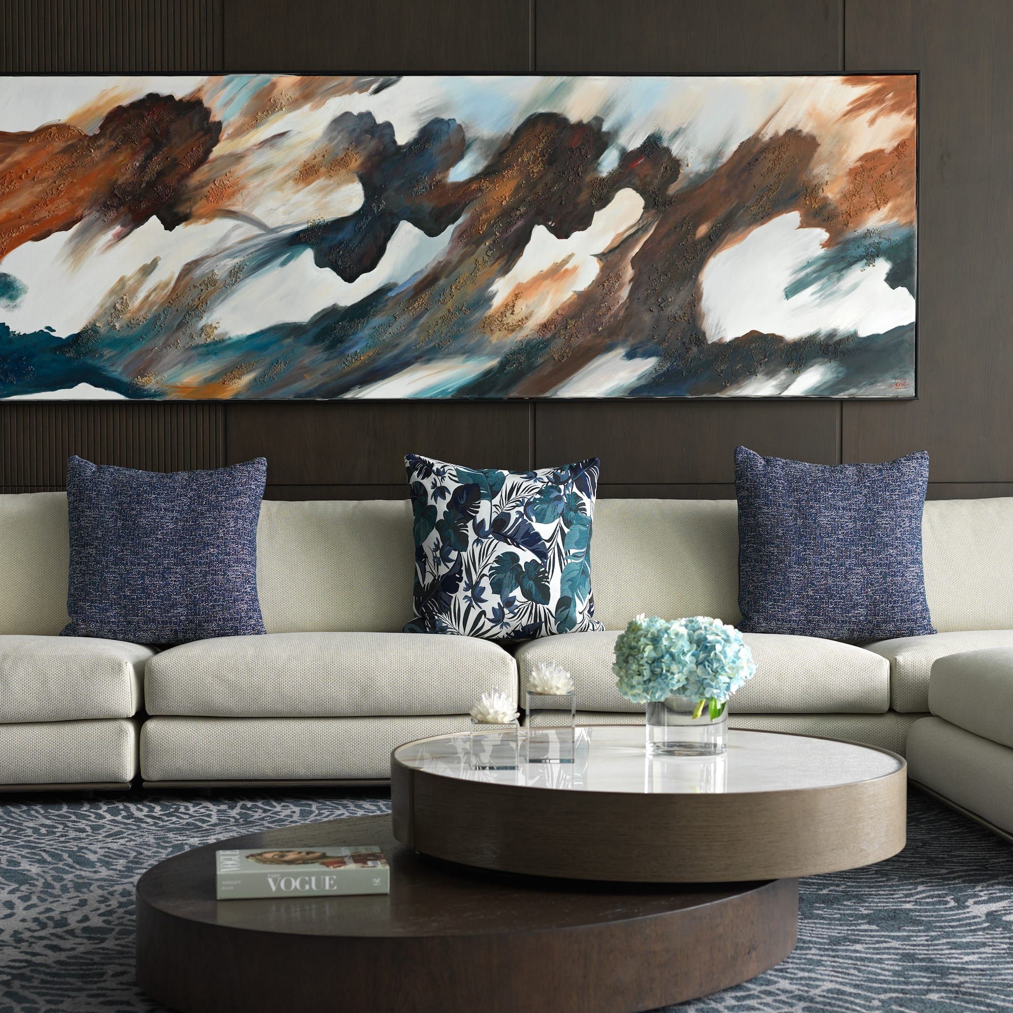 a large painting on a wall above a couch