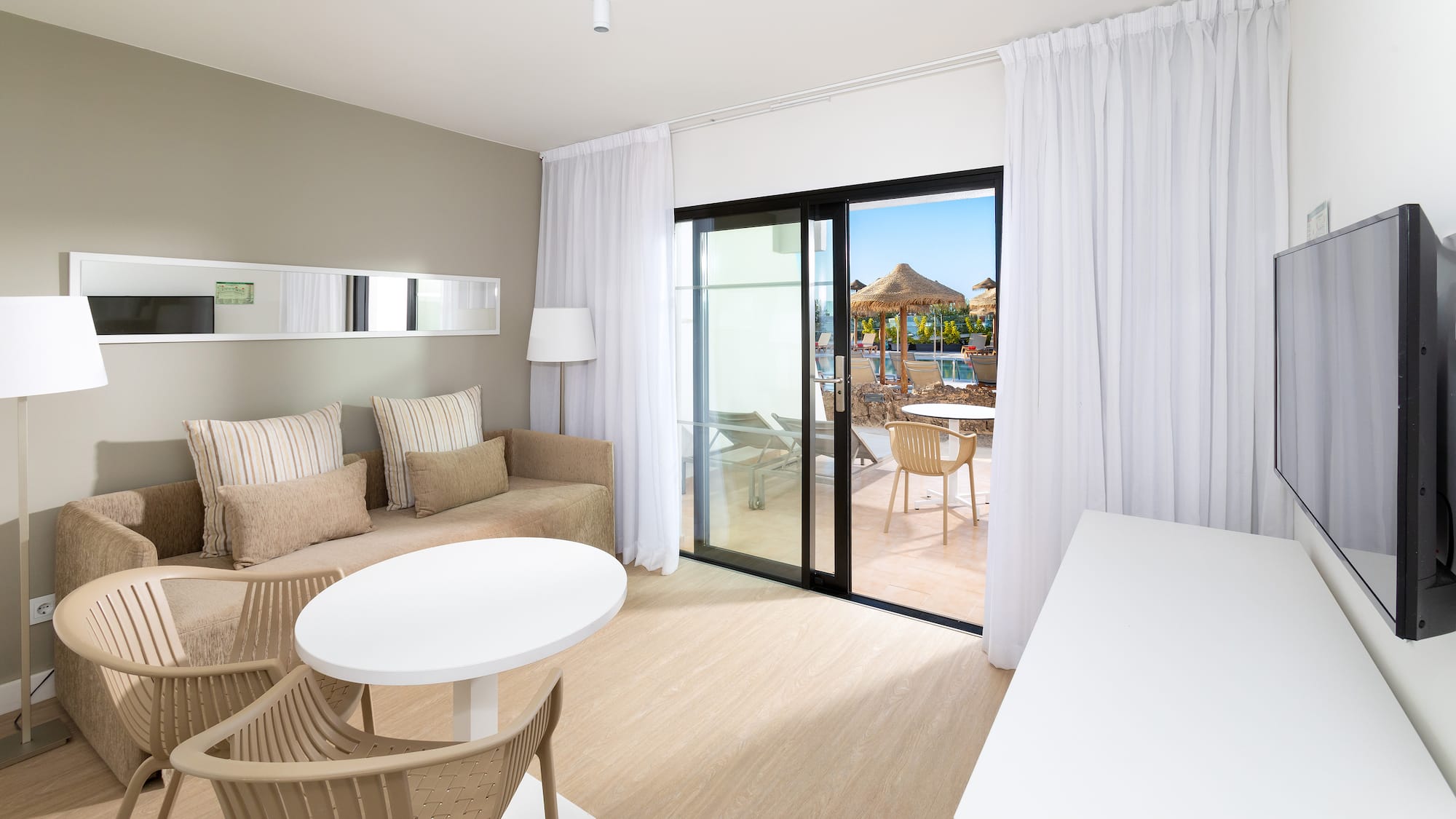 a room with a table and chairs