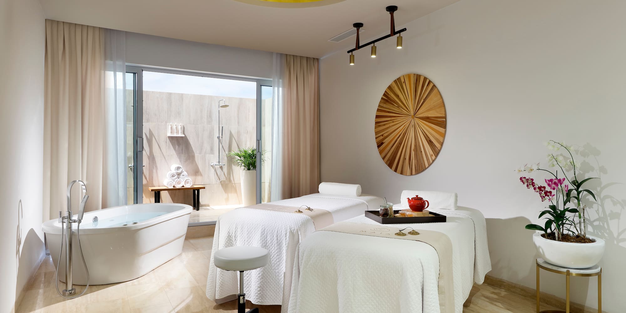 a room with beds and tubs