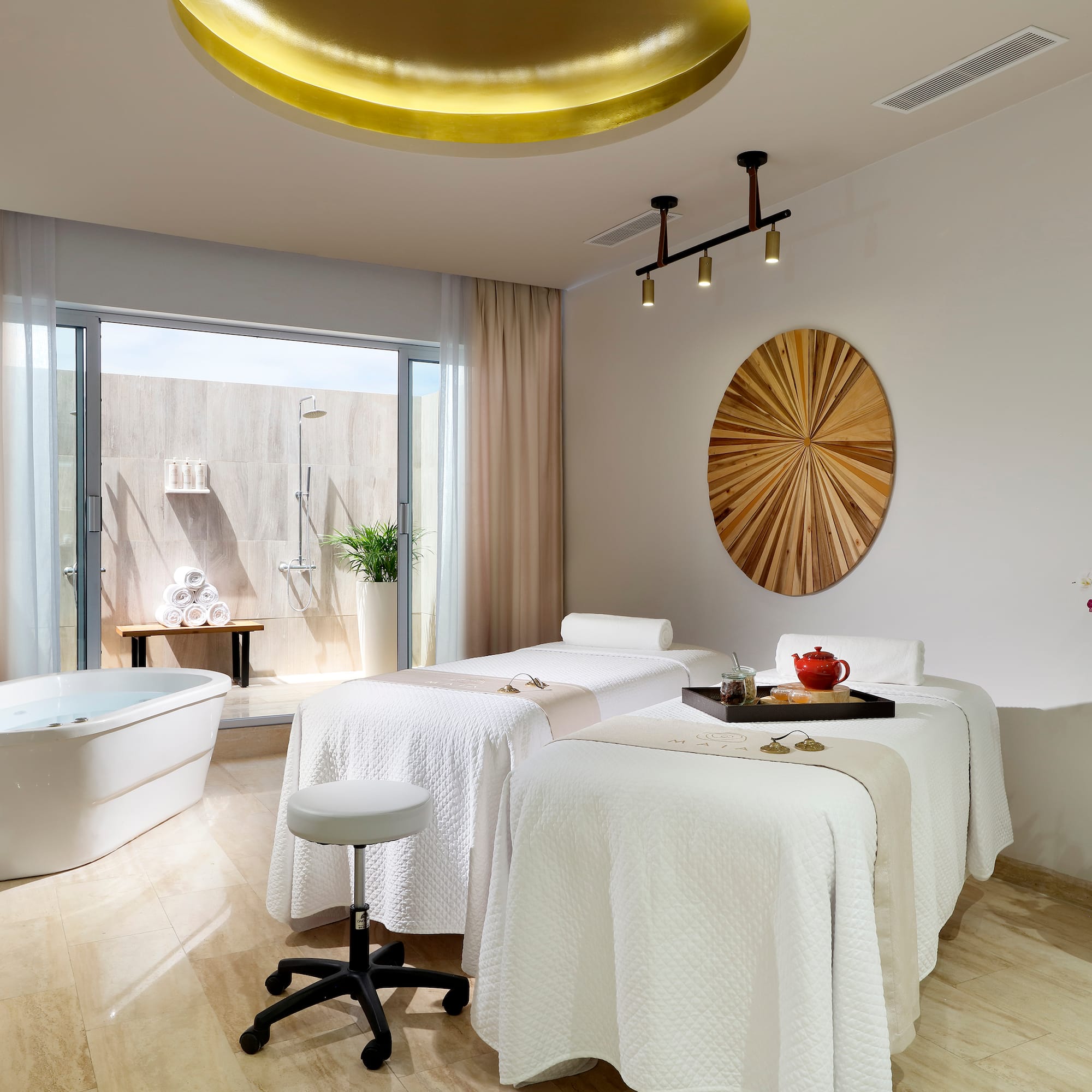 a room with beds and tubs