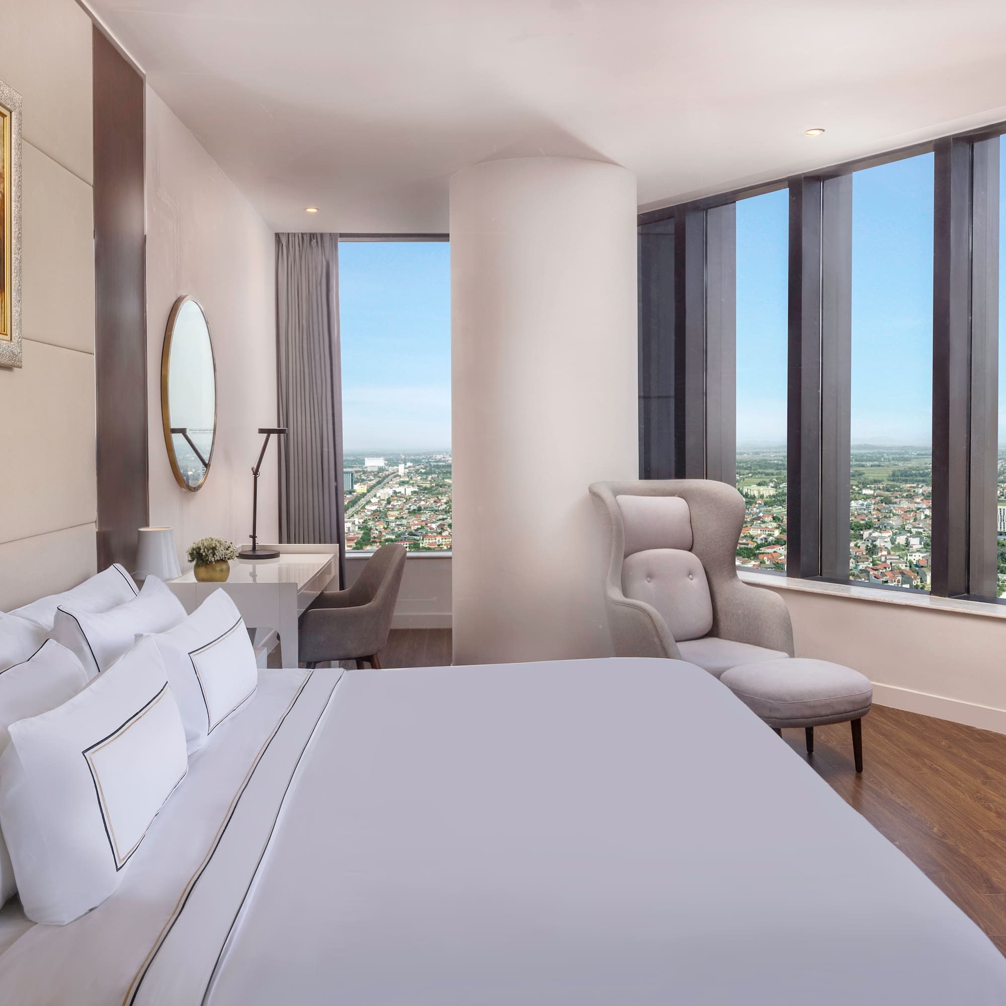 a bedroom with a large window and a large bed