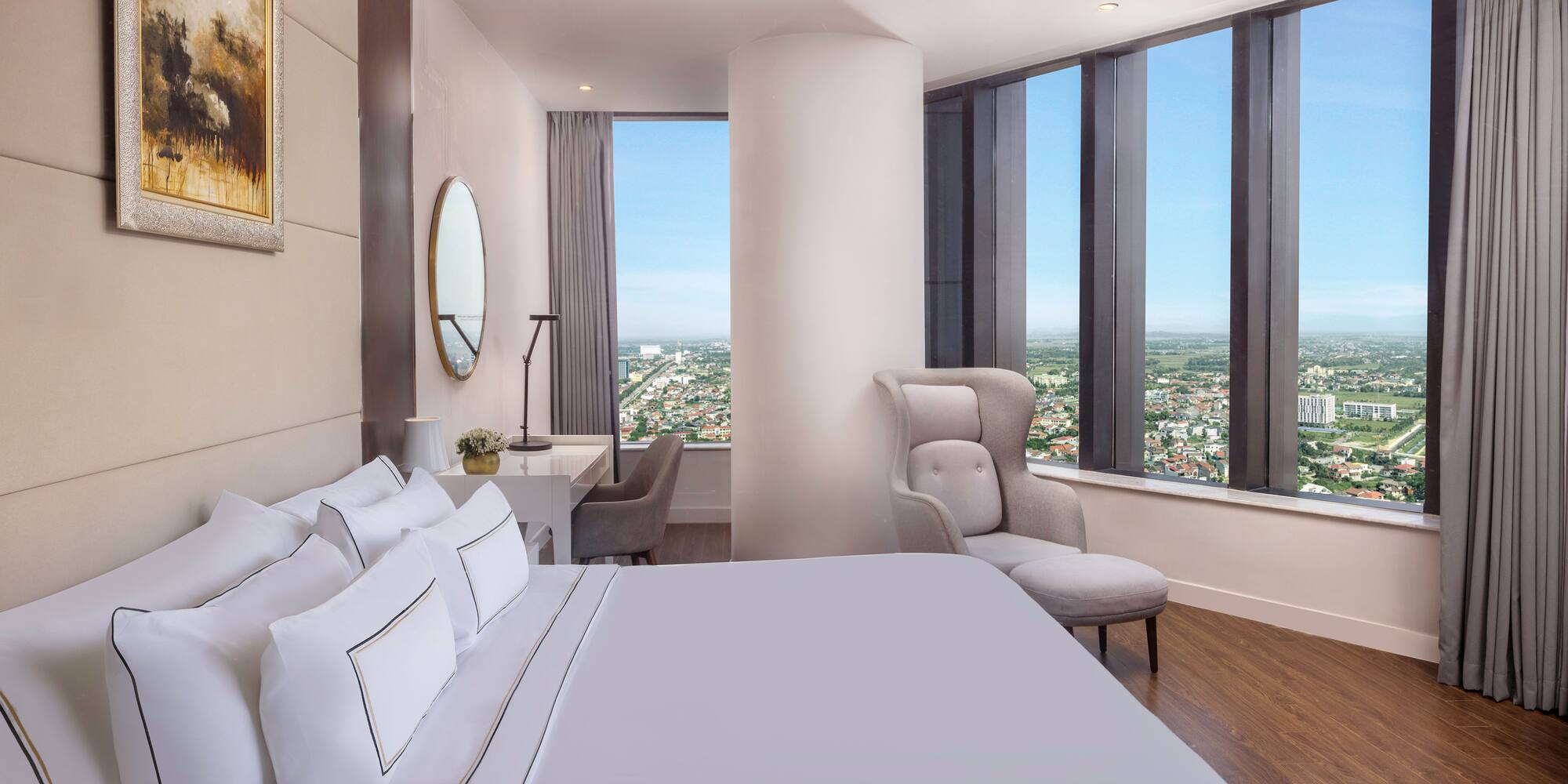 a bedroom with a large window and a large bed