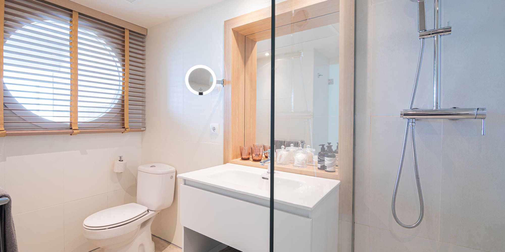 a bathroom with a shower and a sink