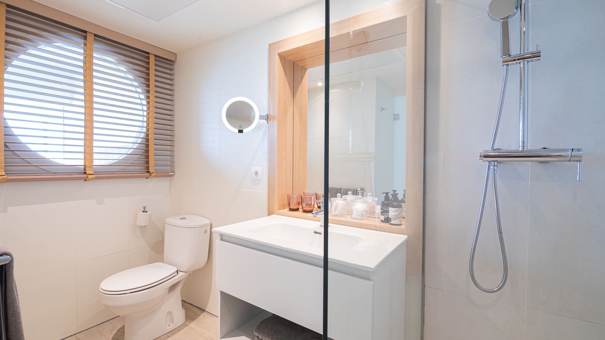 a bathroom with a shower and a sink