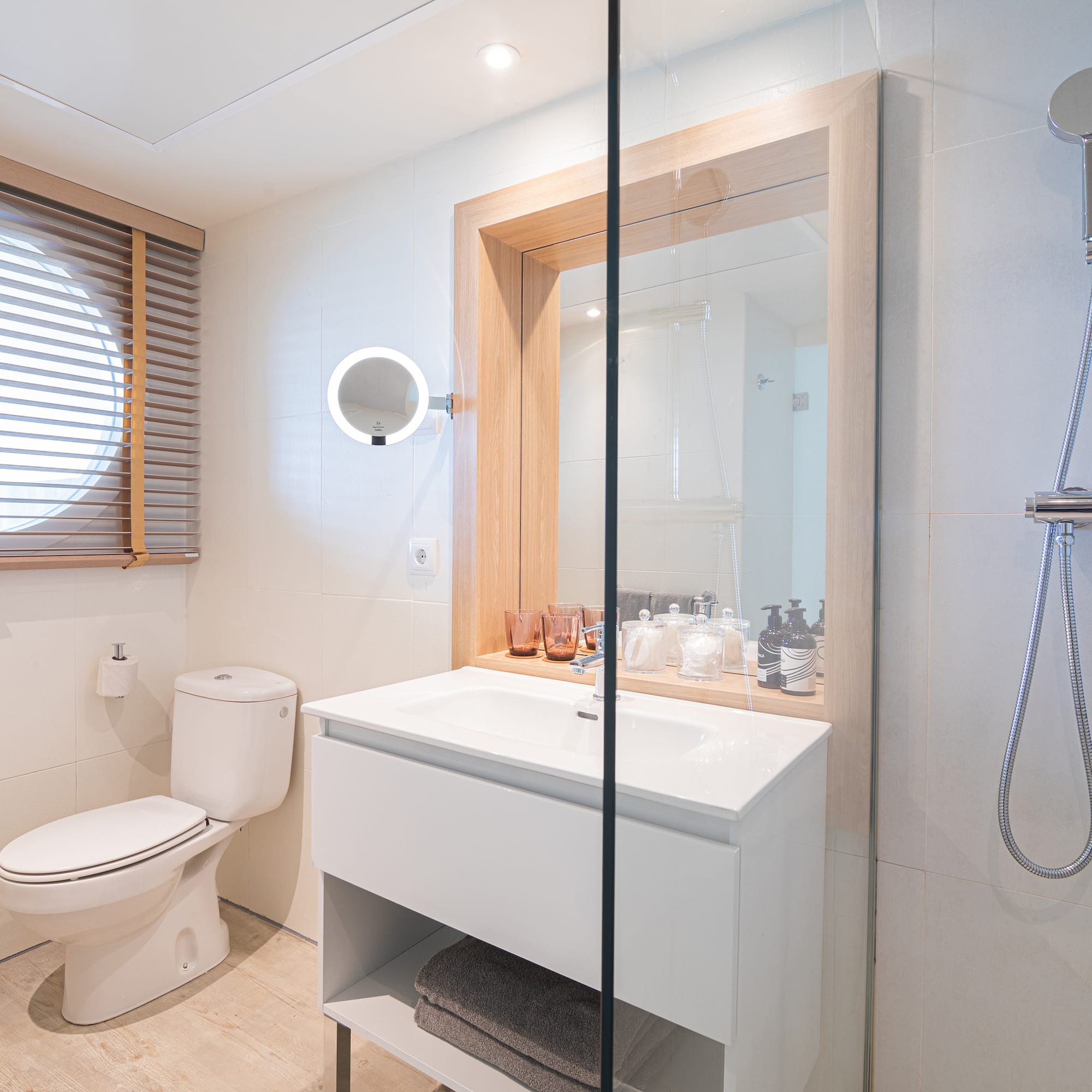 a bathroom with a shower and a sink