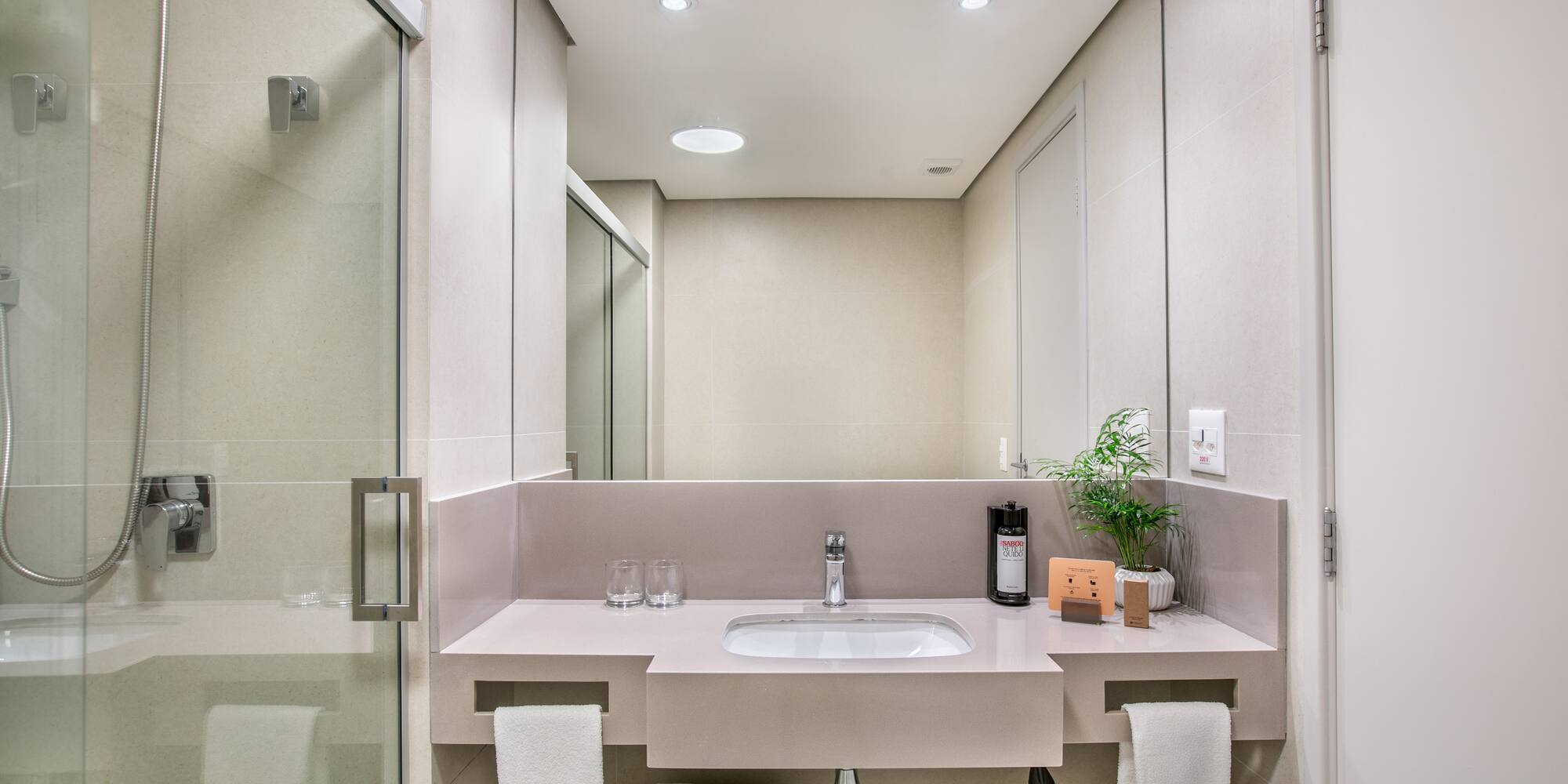 a bathroom with a sink and shower