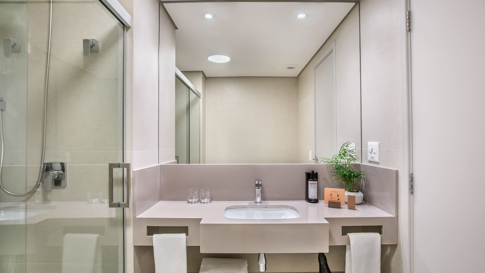 a bathroom with a sink and shower