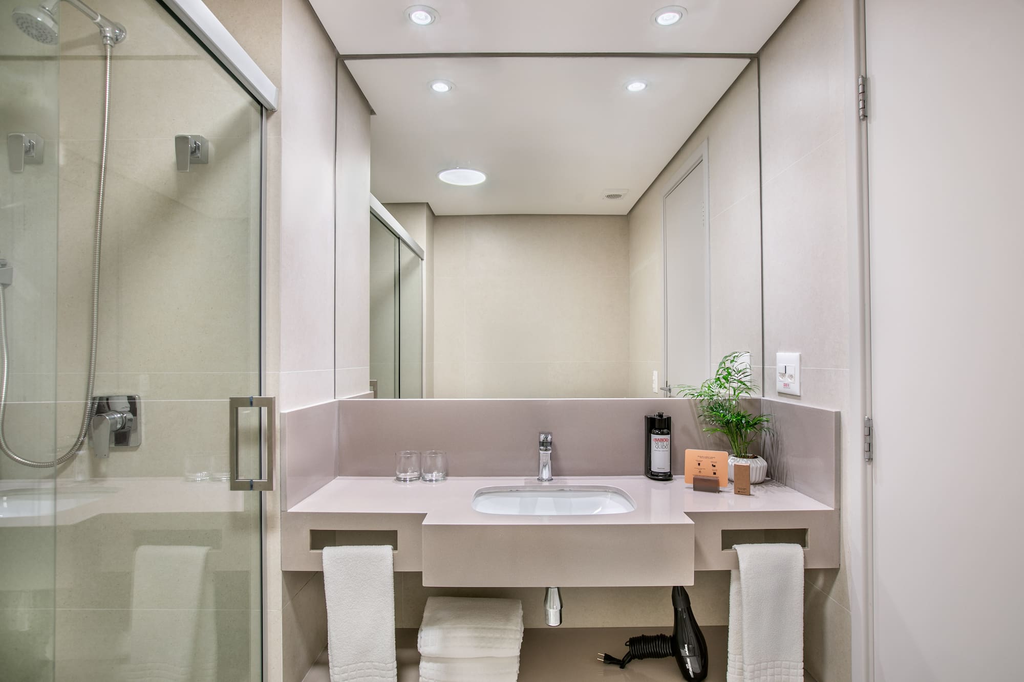 a bathroom with a sink and shower