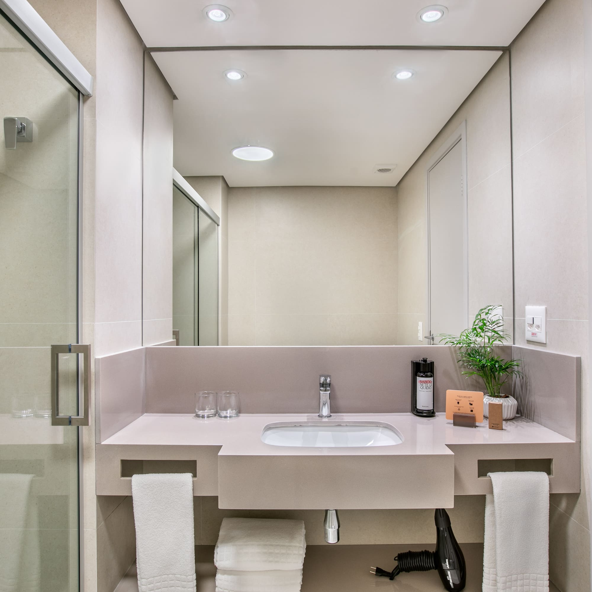 a bathroom with a sink and shower