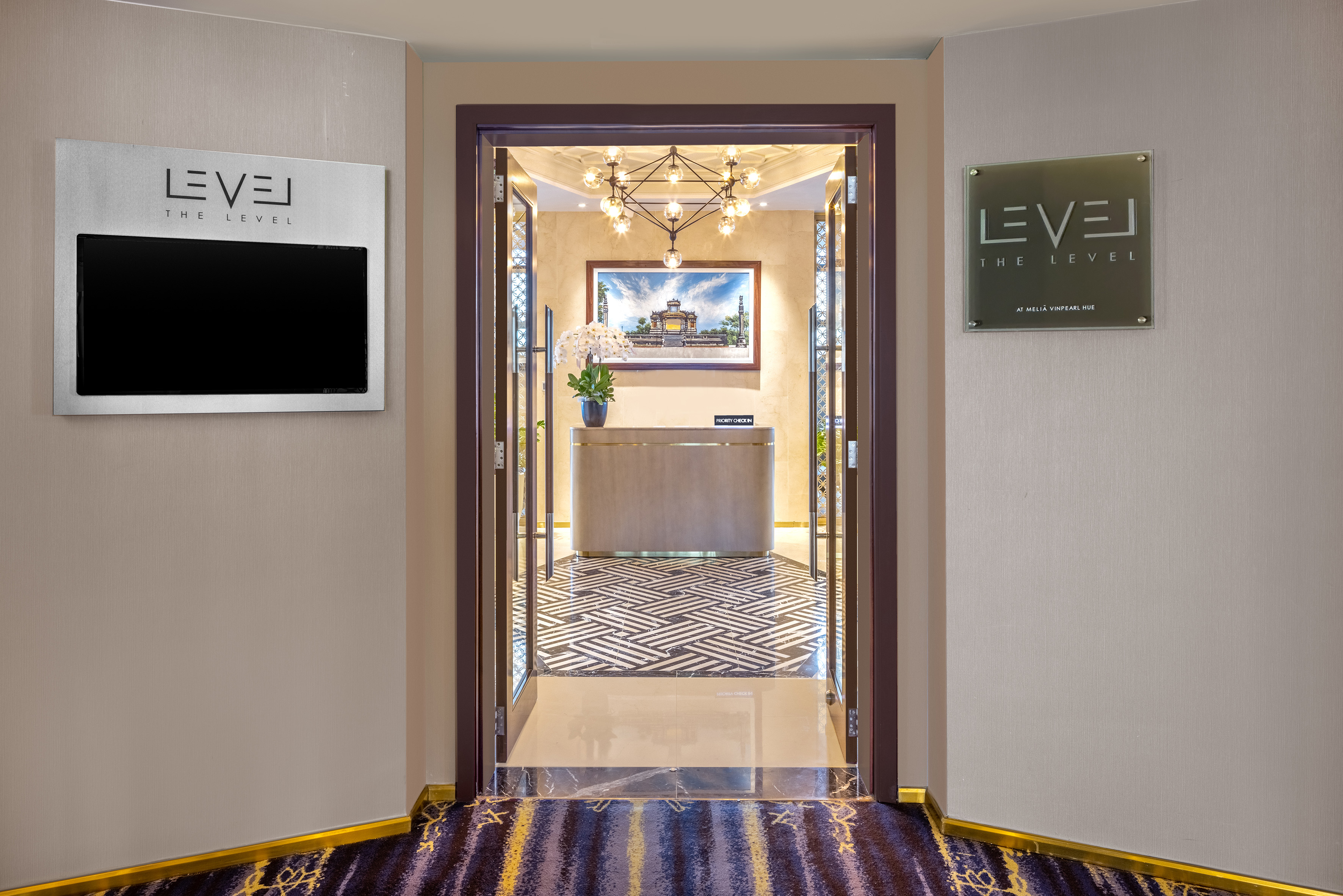 a hallway with a door and a mirror