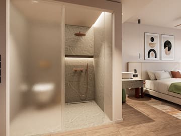 a bathroom with a shower and a bed
