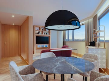 a room with a table and chairs