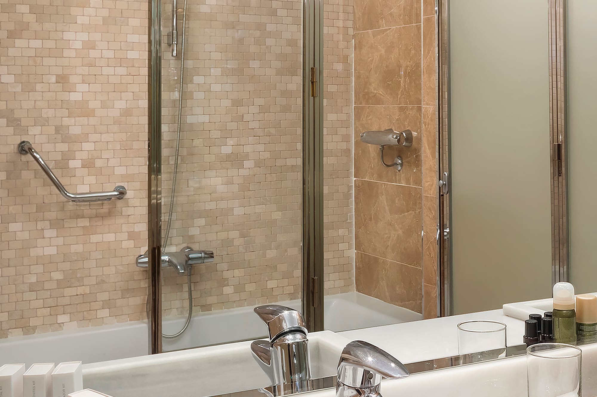 a bathroom with a shower and sink