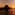 Es Vedra island silhouette at sunset over the Mediterranean Sea.