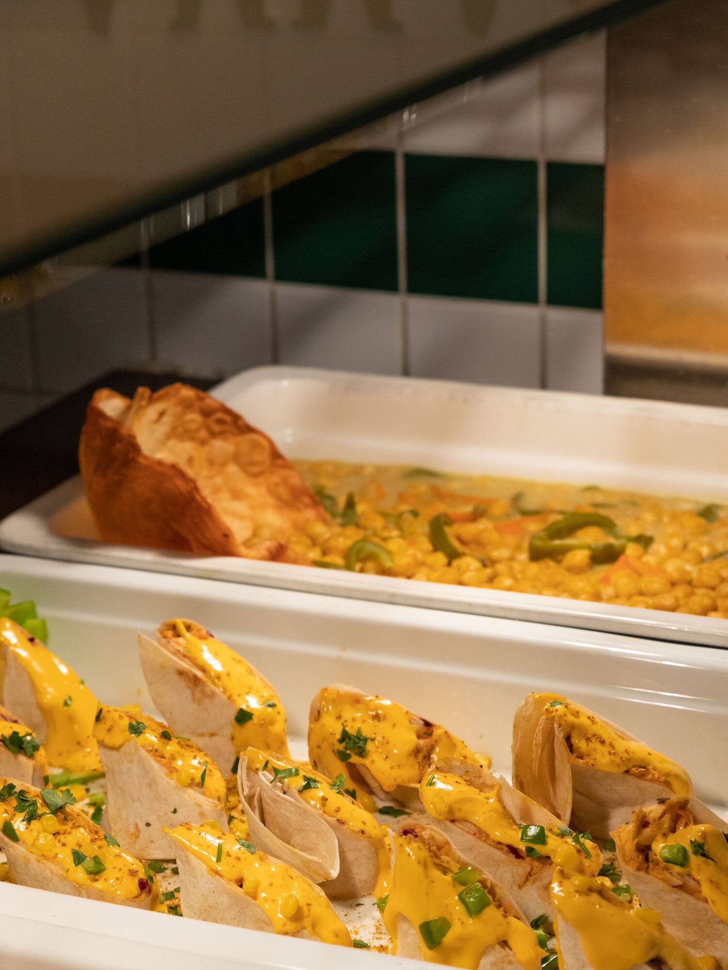 food in a container with tortillas