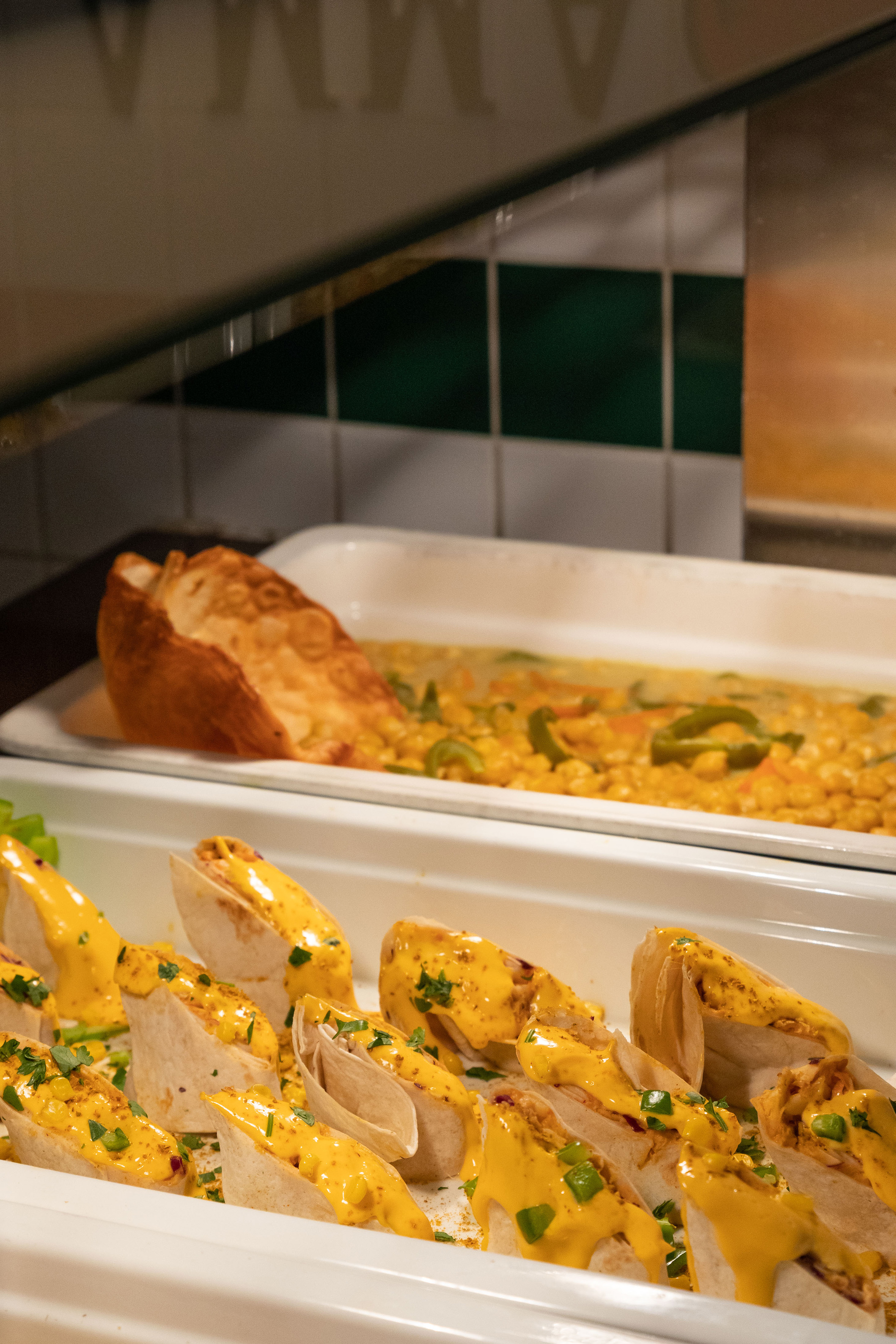 food in a container with tortillas