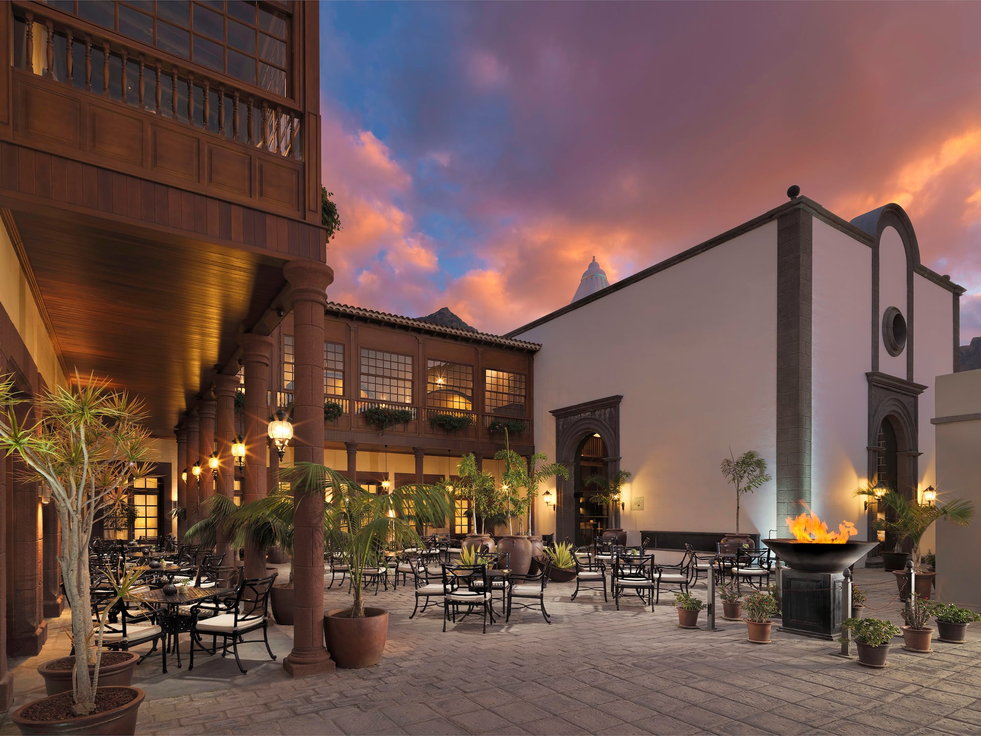 a courtyard with tables and chairs