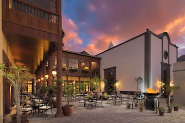 a courtyard with tables and chairs