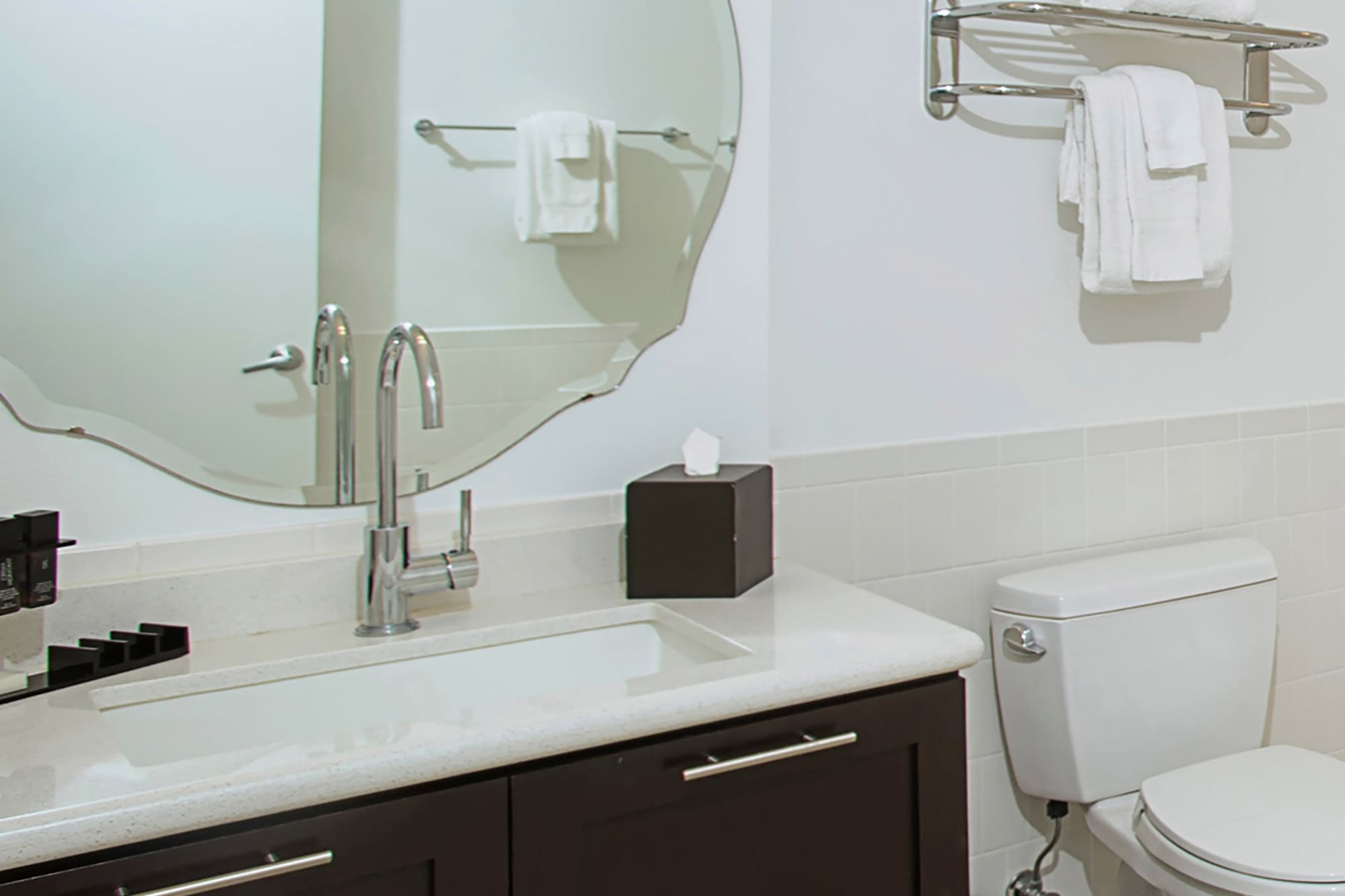 a bathroom with a mirror and a toilet