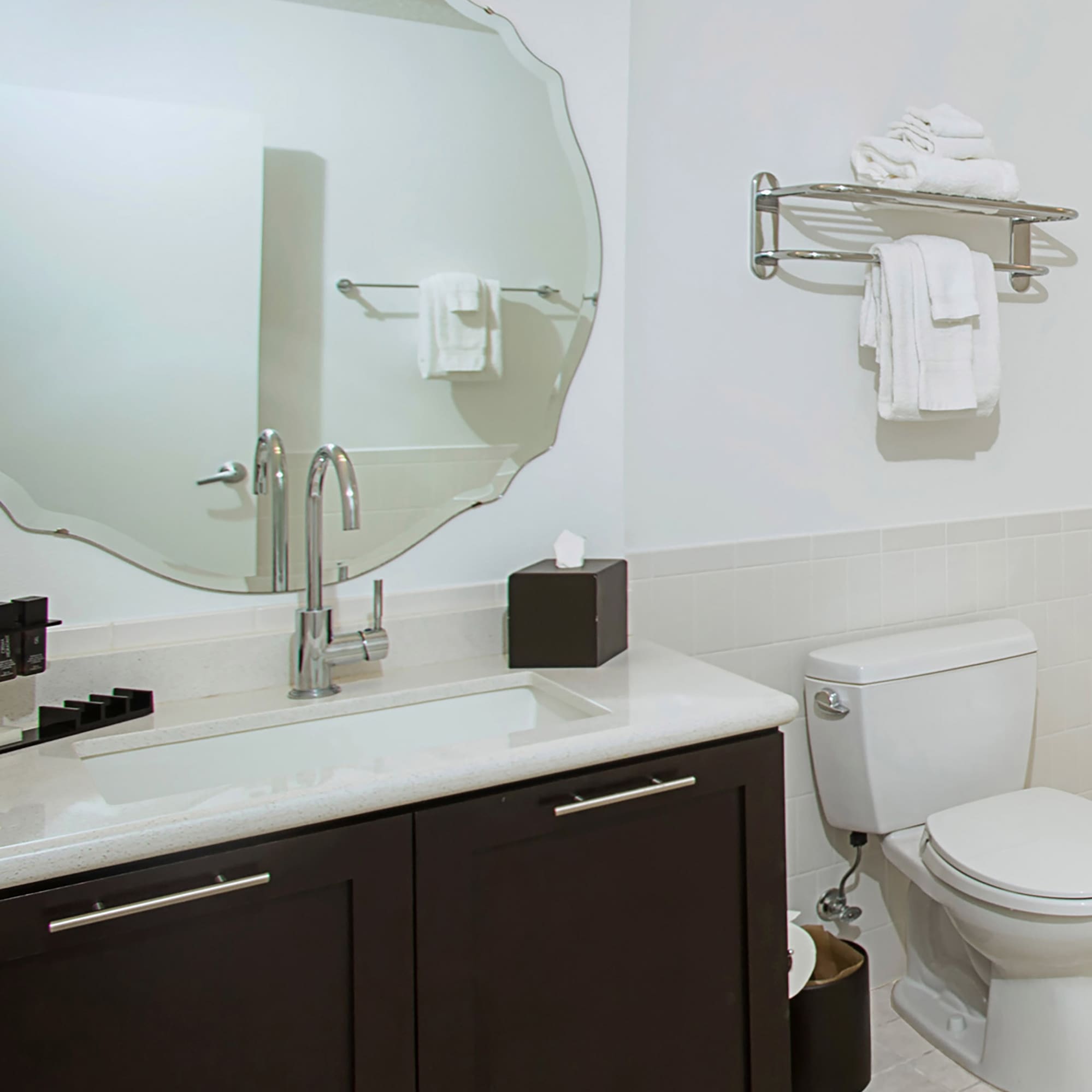 a bathroom with a mirror and a toilet