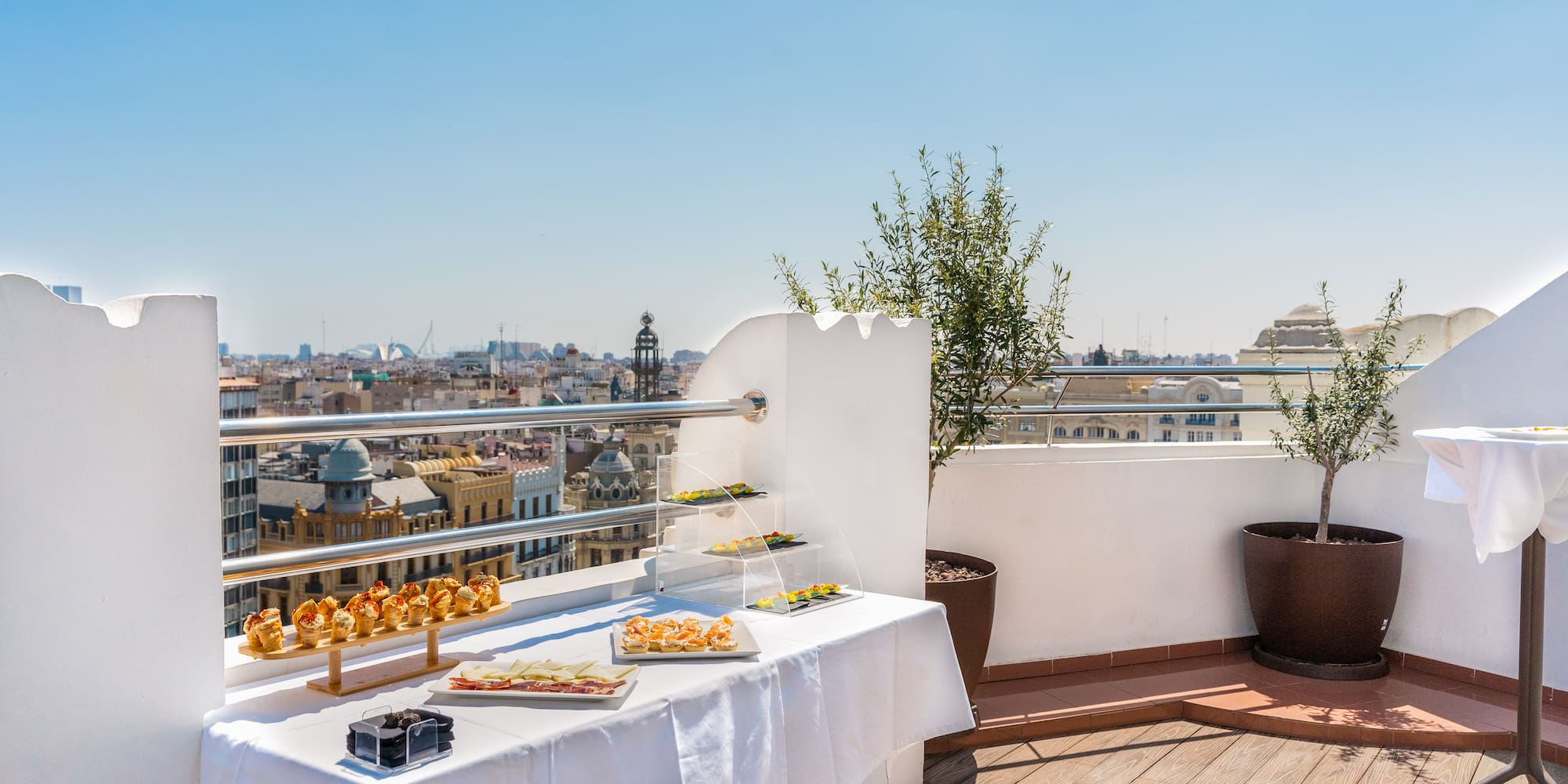 a table with food on it on a balcony