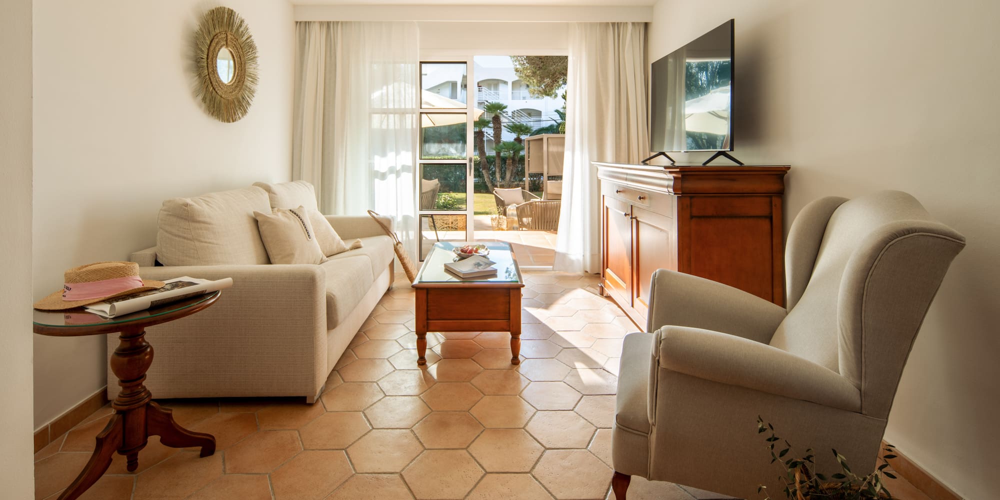 a living room with a television and couches