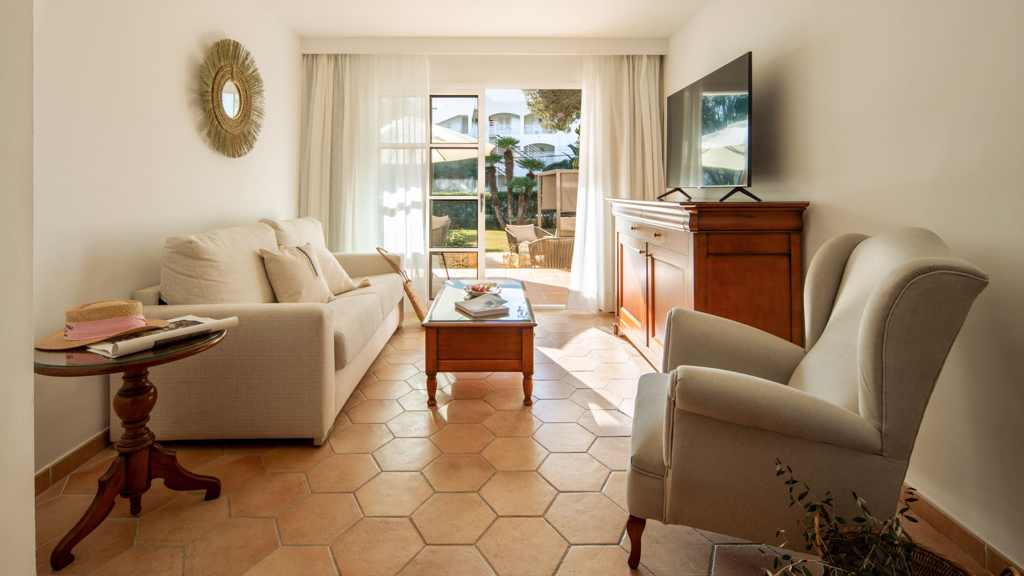 a living room with a television and couches
