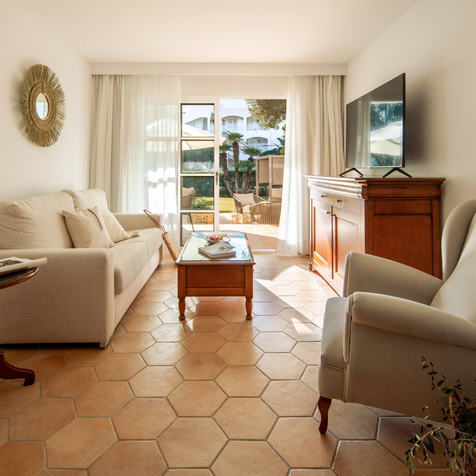 a living room with a television and couches