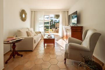a living room with a television and couches