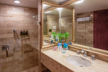 a bathroom with a mirror and a sink