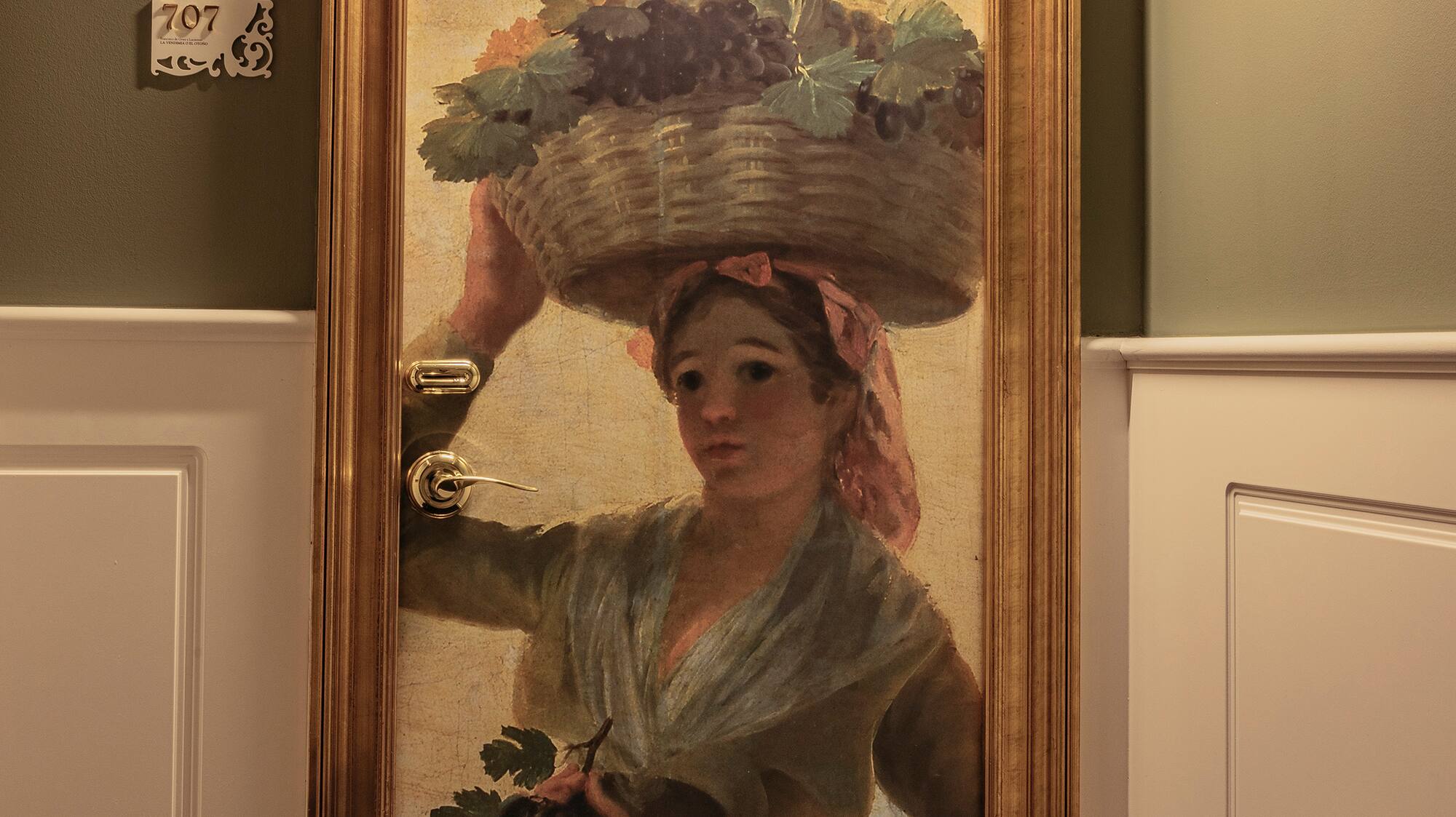 a painting of a woman holding a basket of fruits on her head