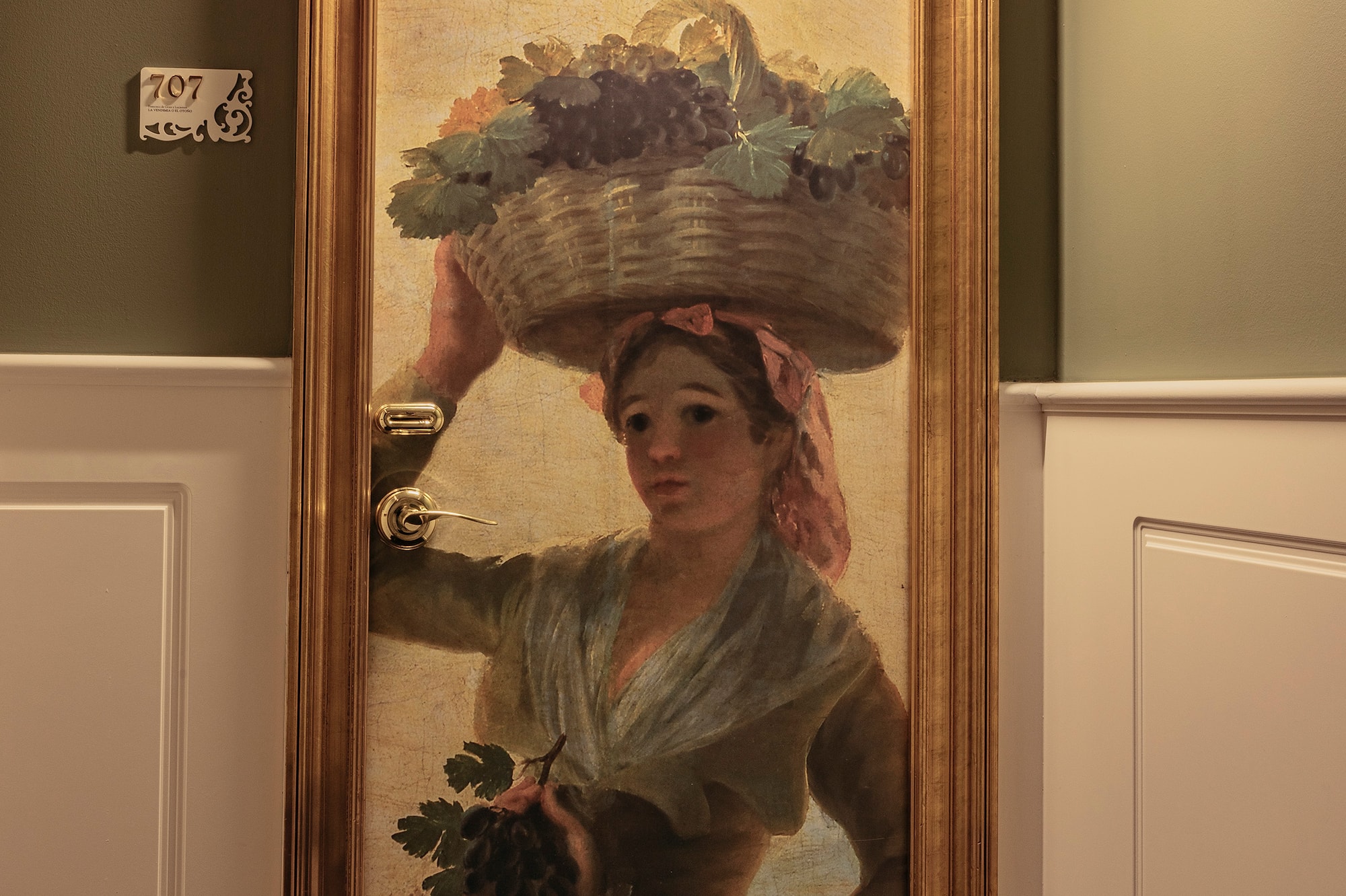 a painting of a woman holding a basket of fruits on her head