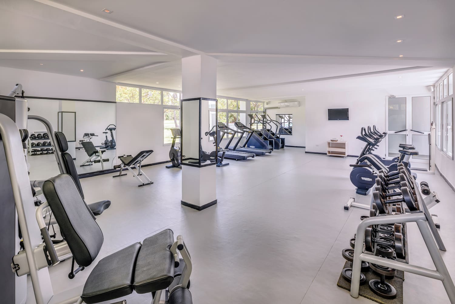 a large room with exercise equipment