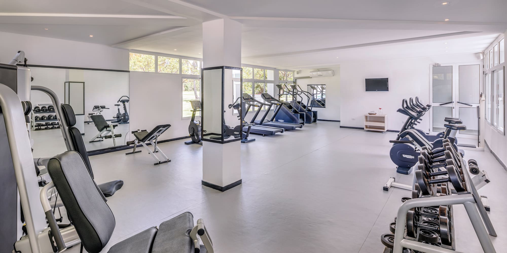 a large room with exercise equipment