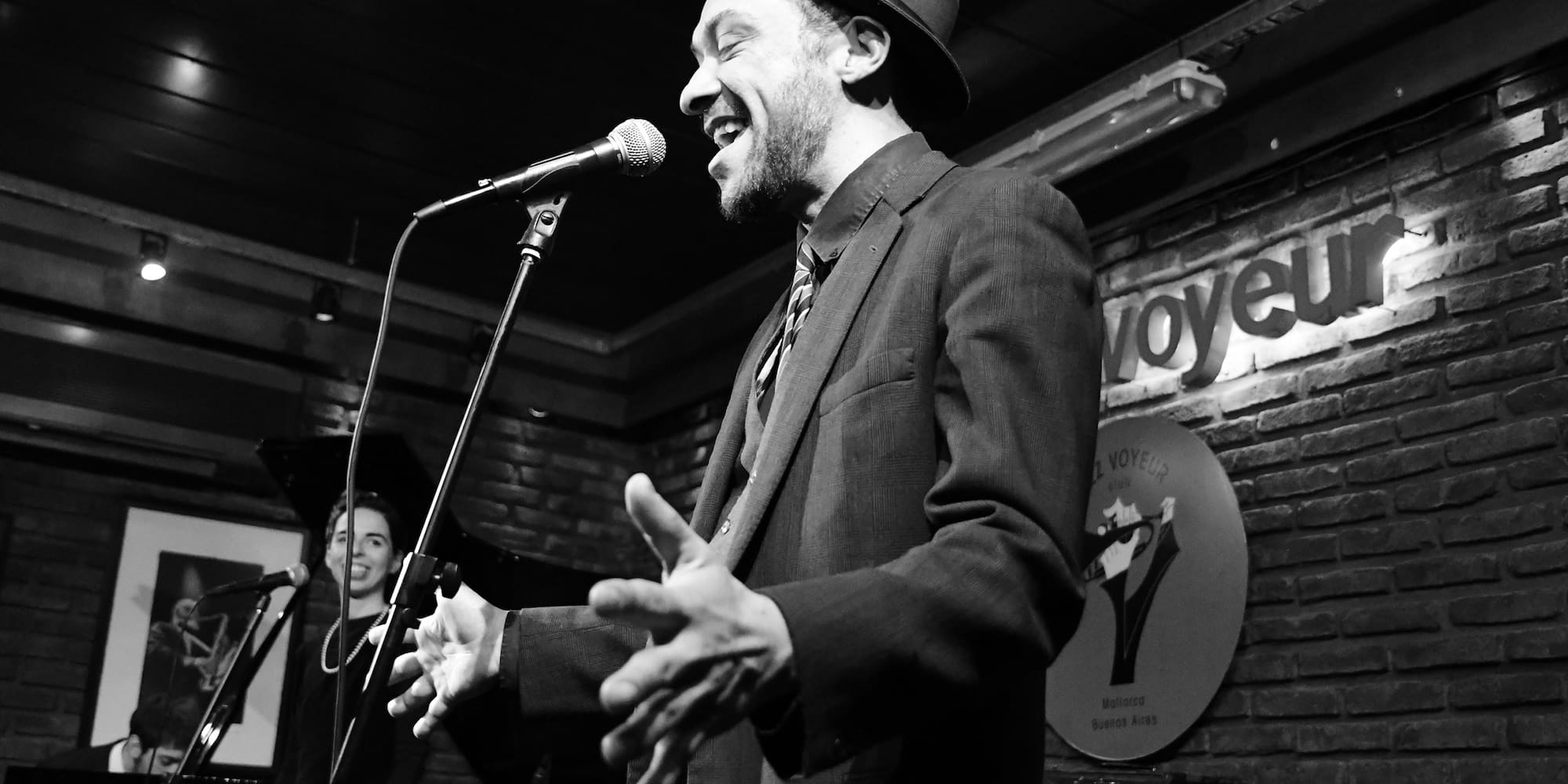 a man singing into a microphone
